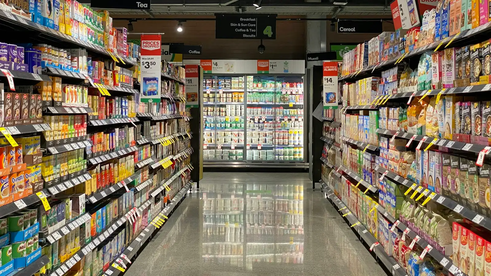 Supermarket aisle stocked with products from many brands