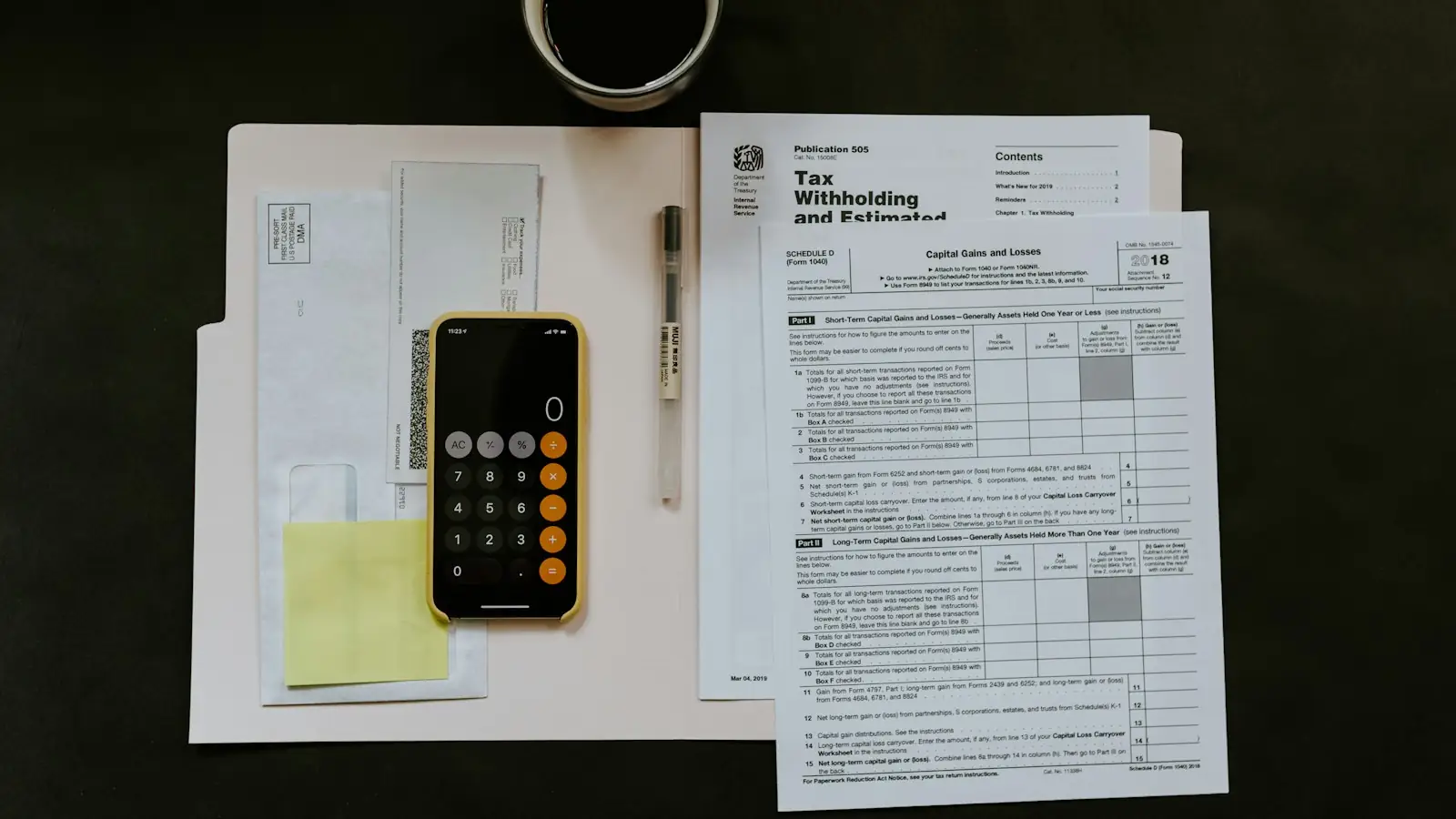 Loan paperwork with a calculator and documents