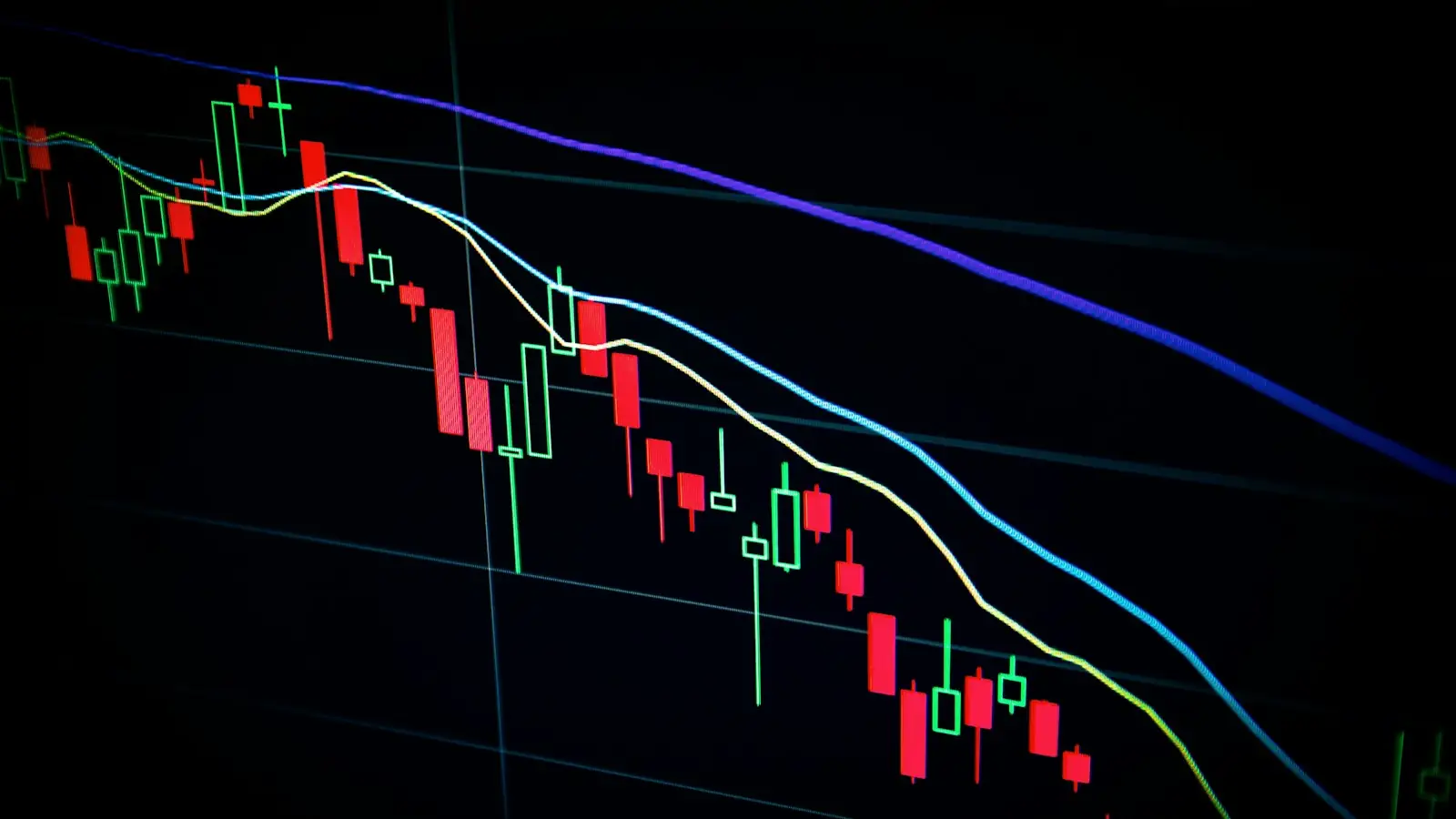 Candlestick trading chart on a dark screen