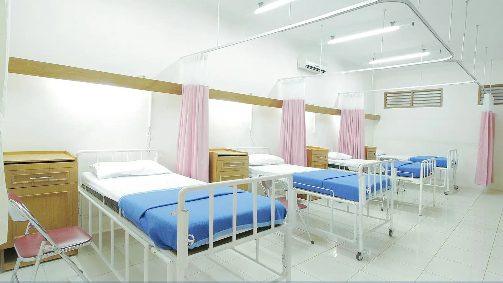 Clean hospital ward with rows of beds