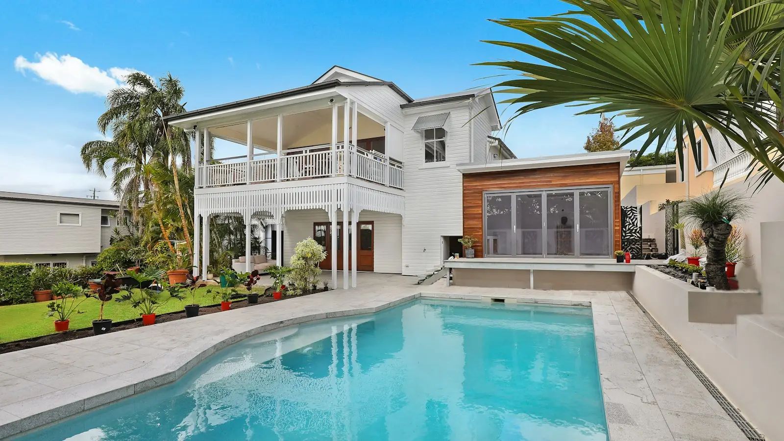 House with a swimming pool and palm trees